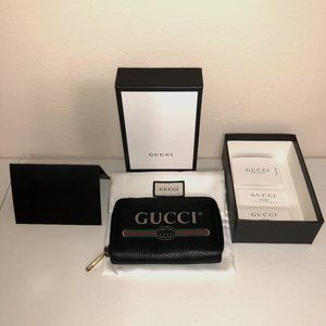 Authentic Gucci leather wallet with Gucci red and green stripe and Gucci emblem